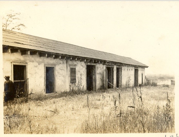 Inner courtyard overgrown with weeds, prior to renovation. July 1930