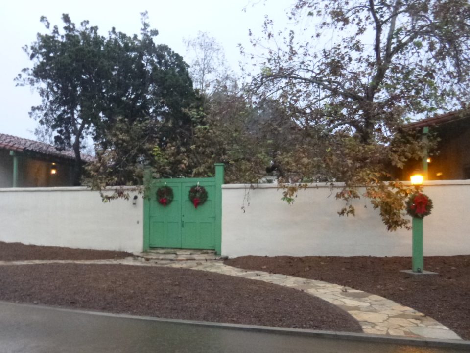 Rancho Los Cerritos hosts Christmas Candlelight Tours on Saturday, December 14, 2019. (Image is of RLC adobe gate to enter to courtyard with lantern lit)